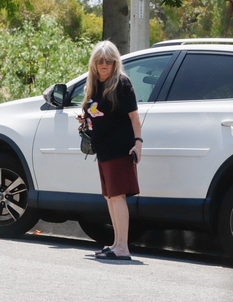 Susan Olsen, former Brady Bunch child star, getting mail.